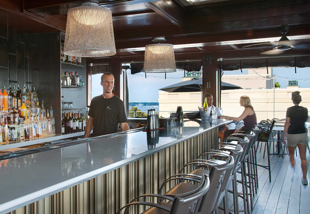 Bartender behind the bar at the rooftop bar