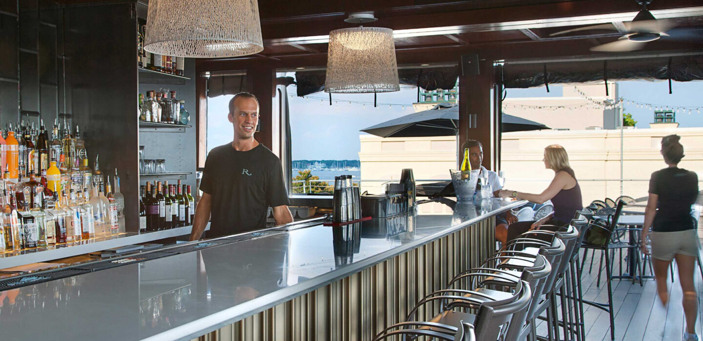Bartender behind the bar at the rooftop bar