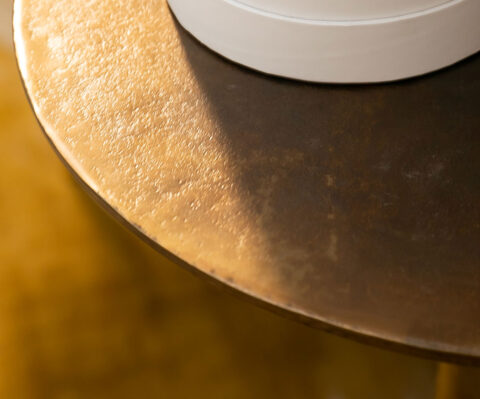close up photo of a gold table top
