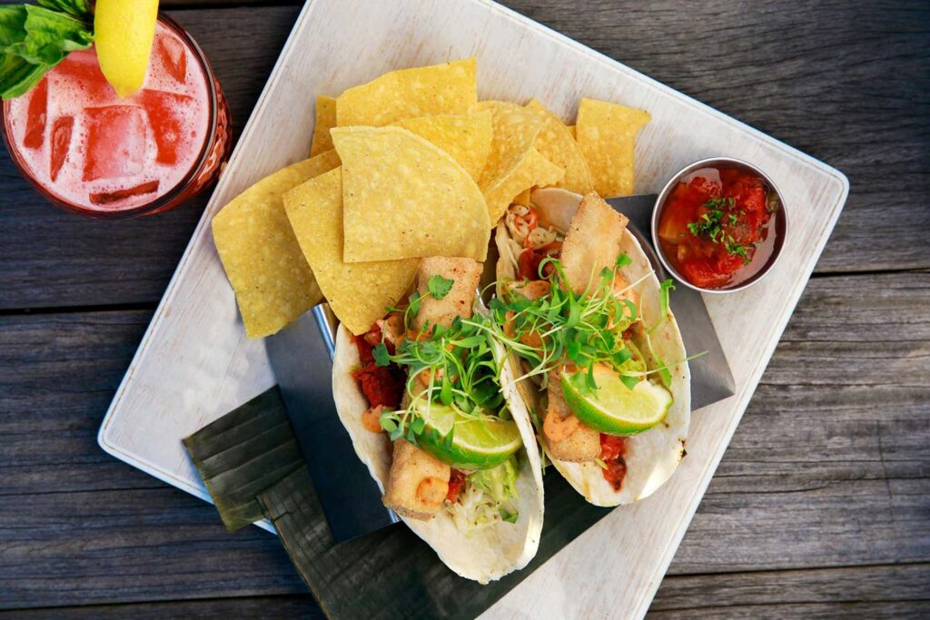 Plate of tacos with chips and salsa