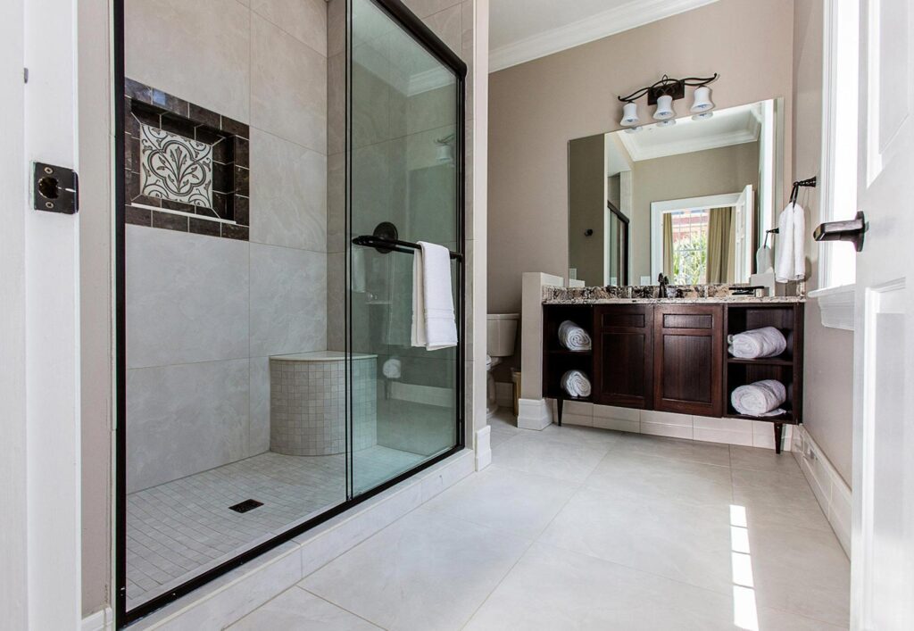 Hotel room bathroom with walk in tile shower