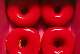 artwork by Jason walker of four red donuts in